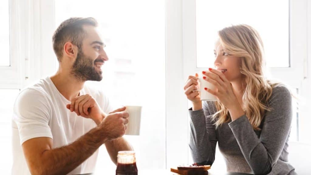 Couple enjoying coffee together at sunrise