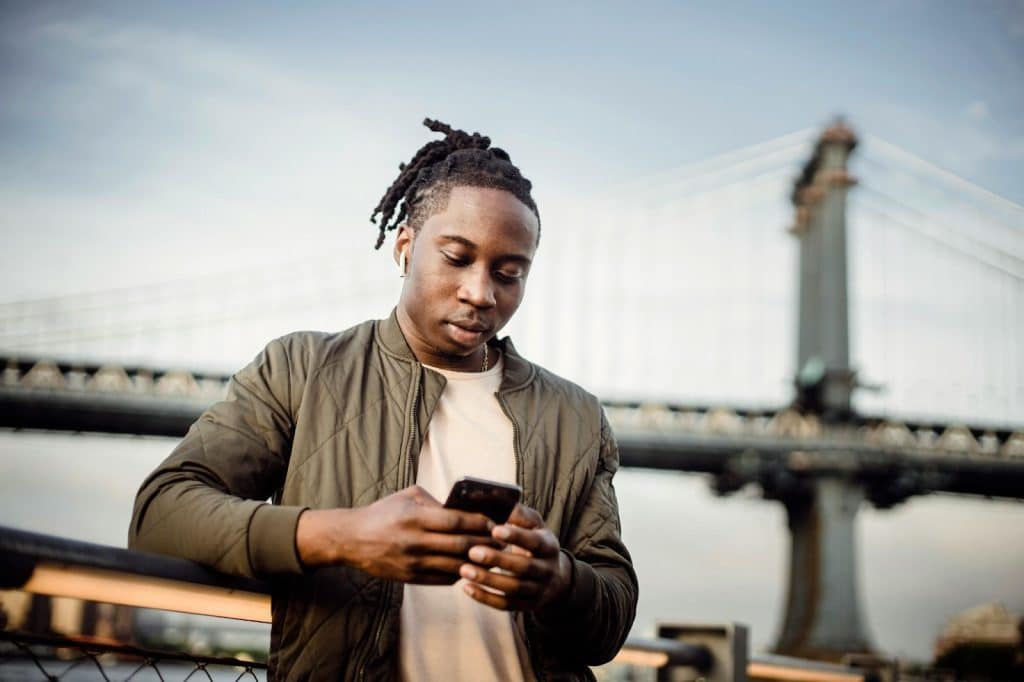A man scrolling through phone
