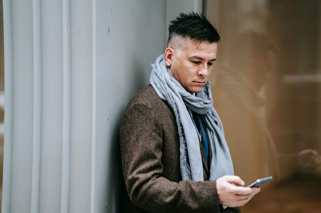 A man scrolling at the phone