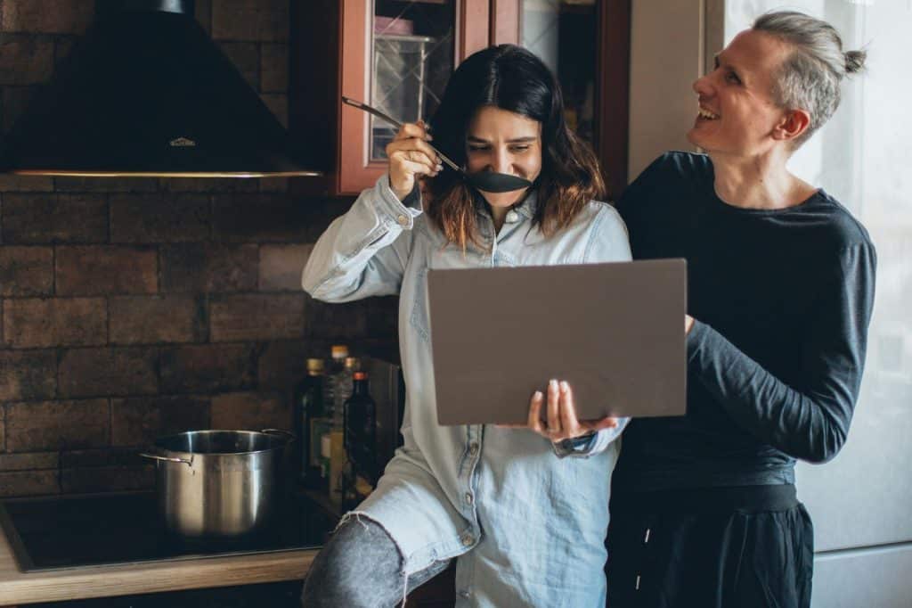 A man making a woman taste his cooking