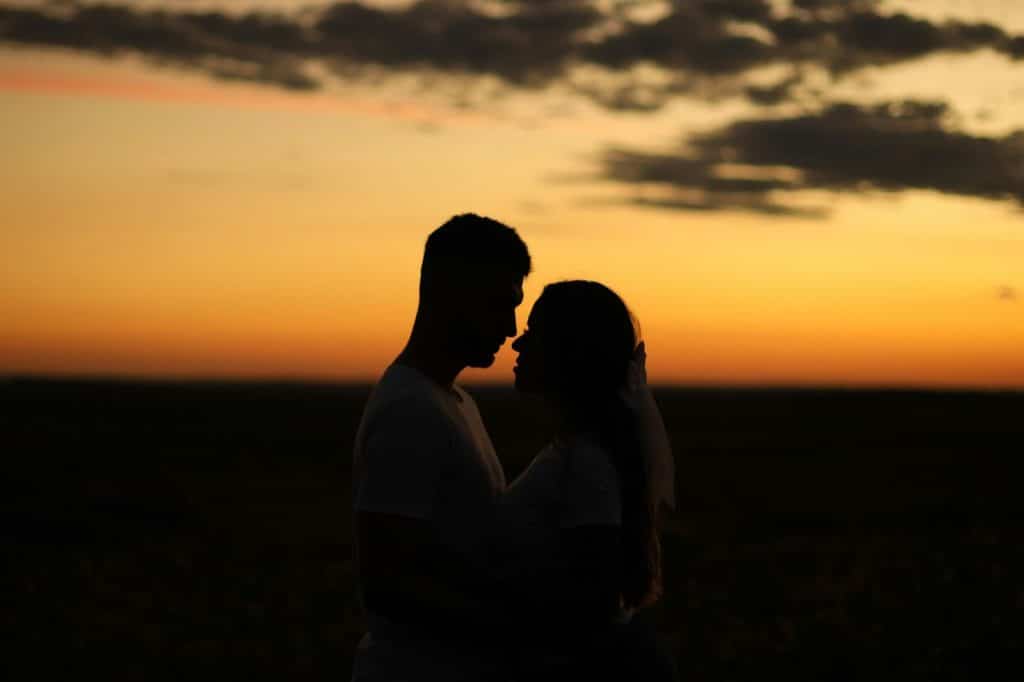 A man and woman at the sunset.
