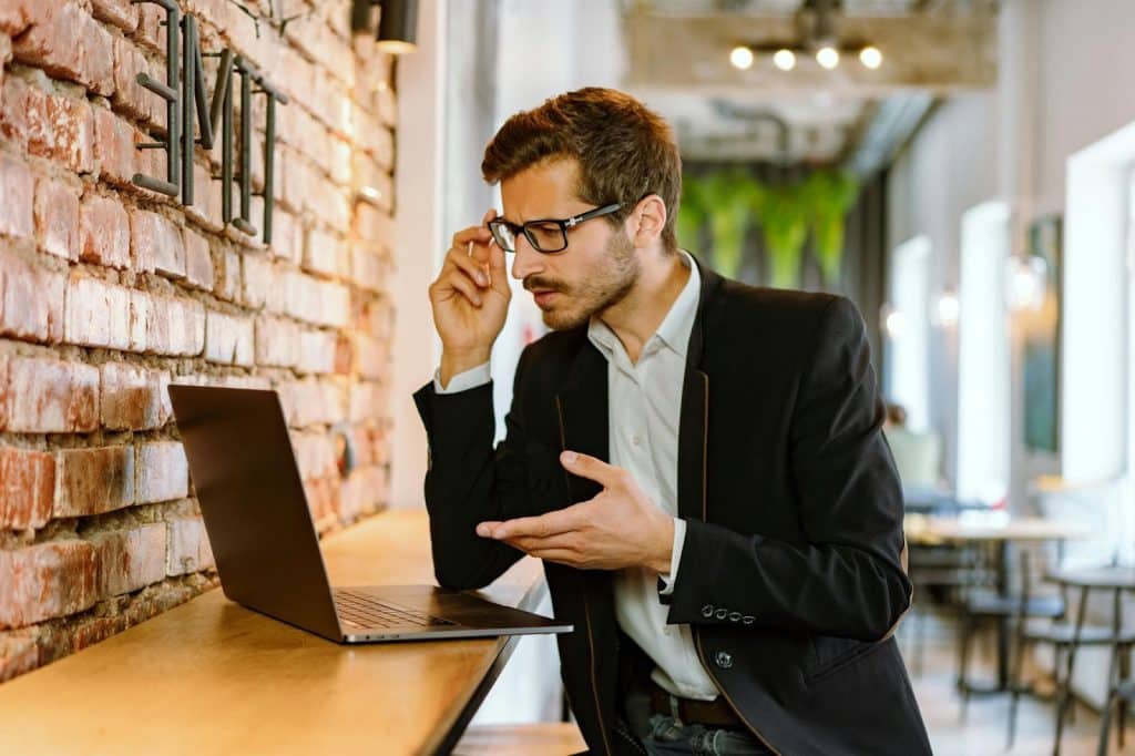 A man looking at the laptop