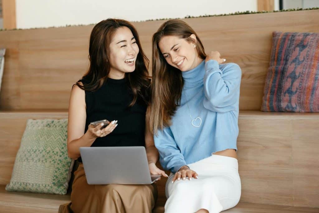 Two women using dating applications