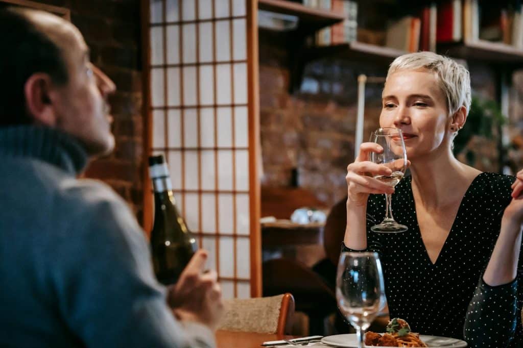A woman looking at the man