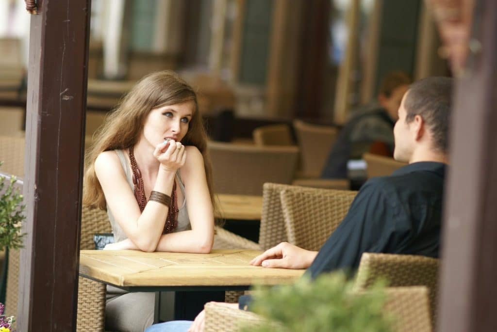 A woman listening to man