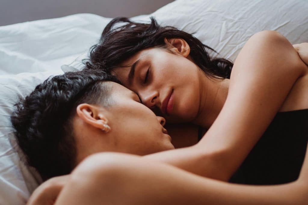 A man and woman hugging each other
