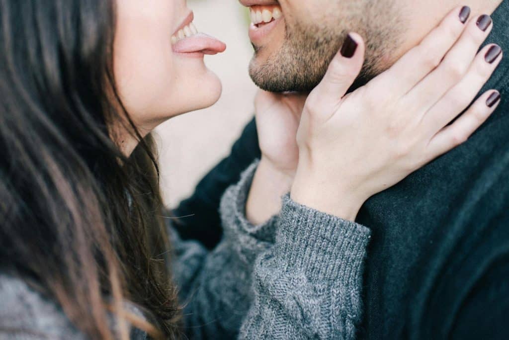 A man and woman facing each other