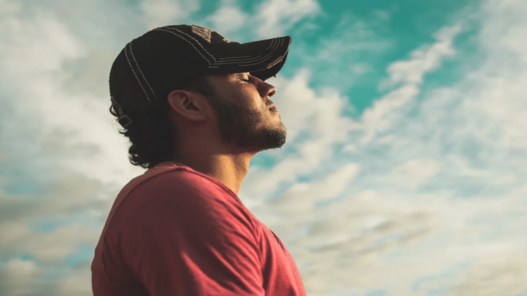 A man taking a deep breath