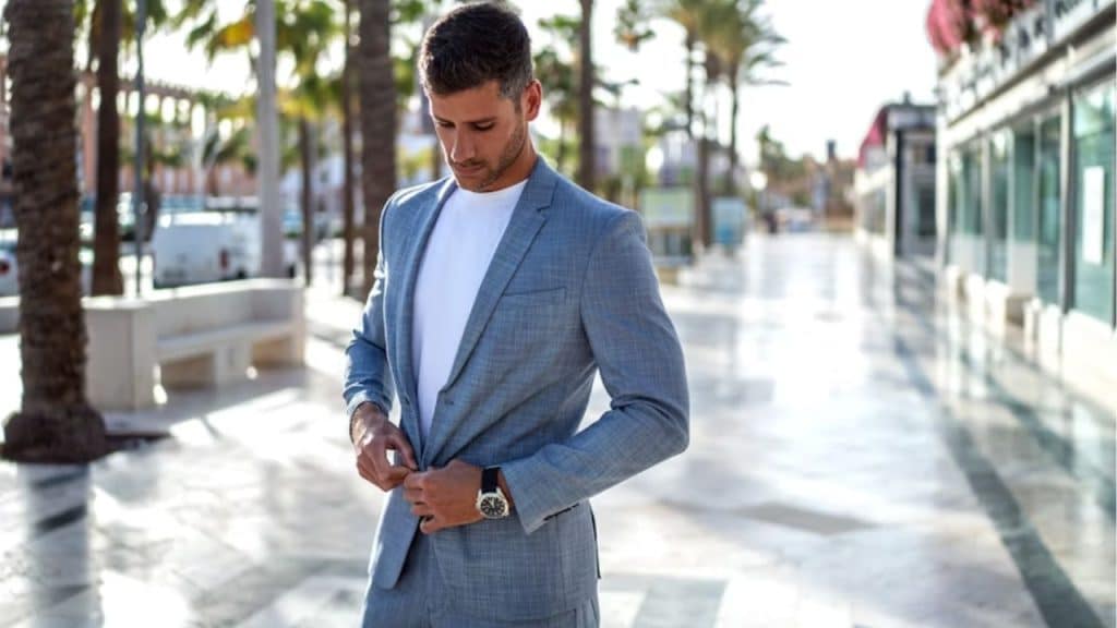 Mature man dressing confidently before heading out