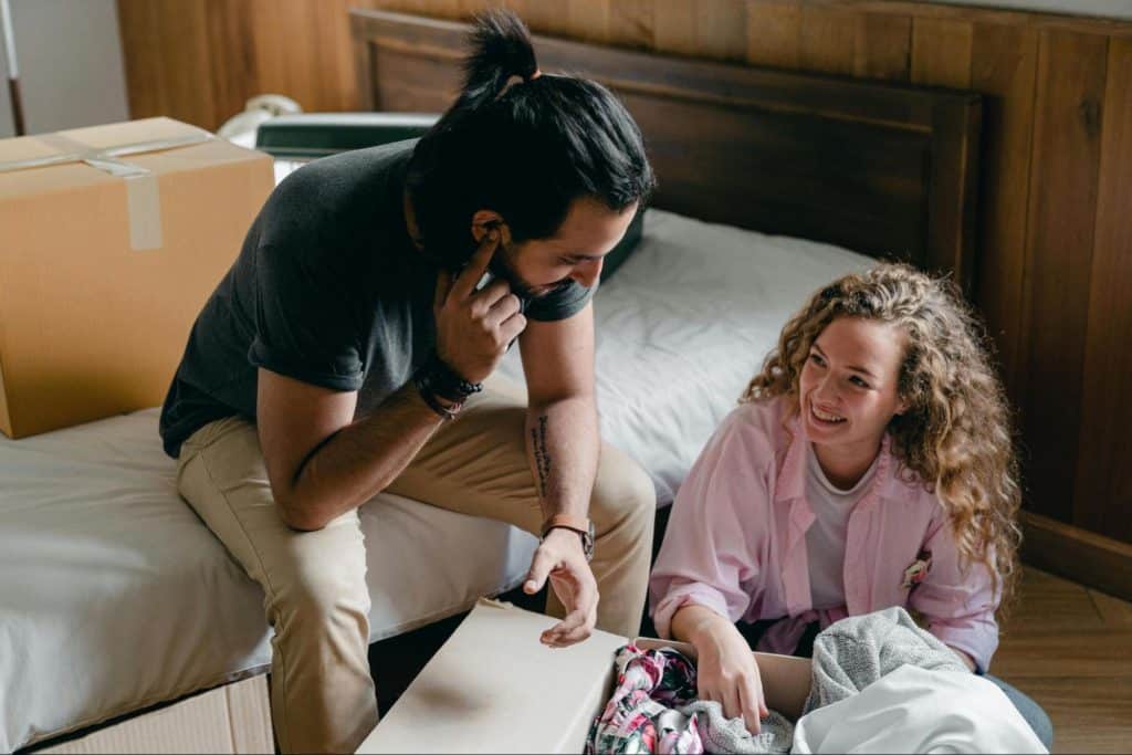 A man and woman laughing together 