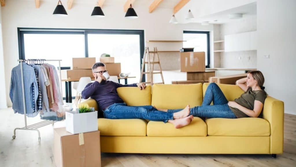 Couple sitting apart with distance between them