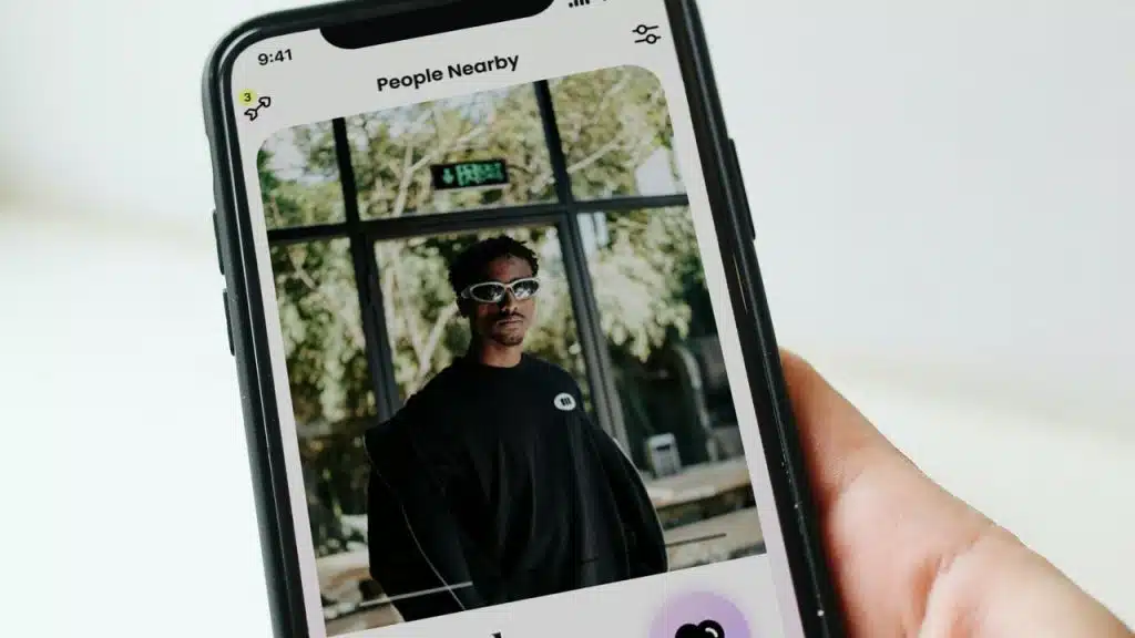 A person’s profile on a dating app shown on a smartphone.
