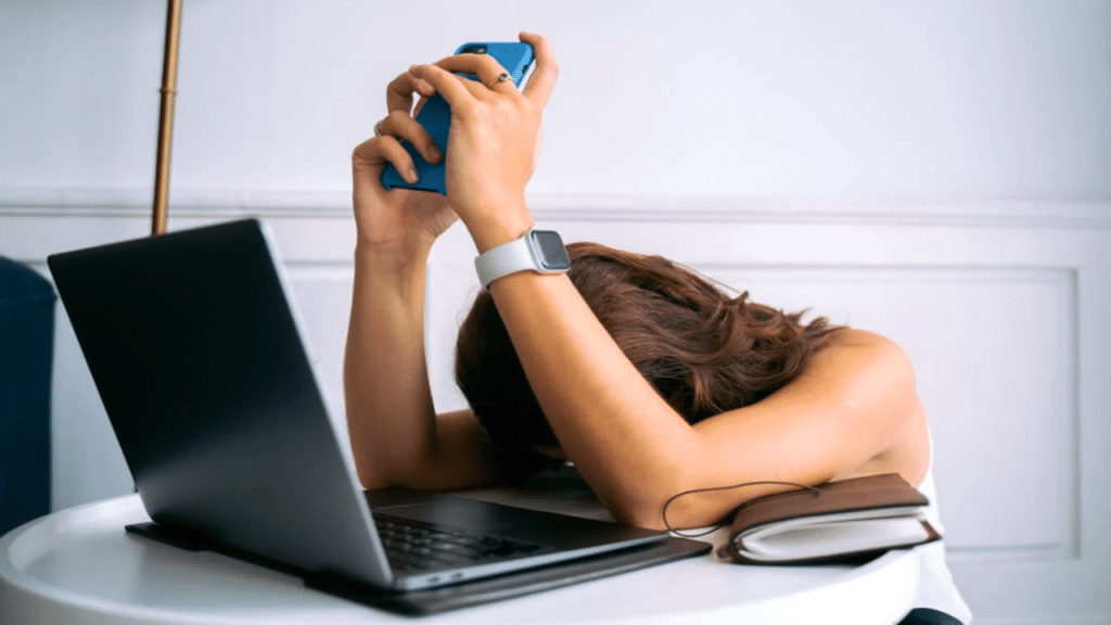 A woman looking tired while working from home