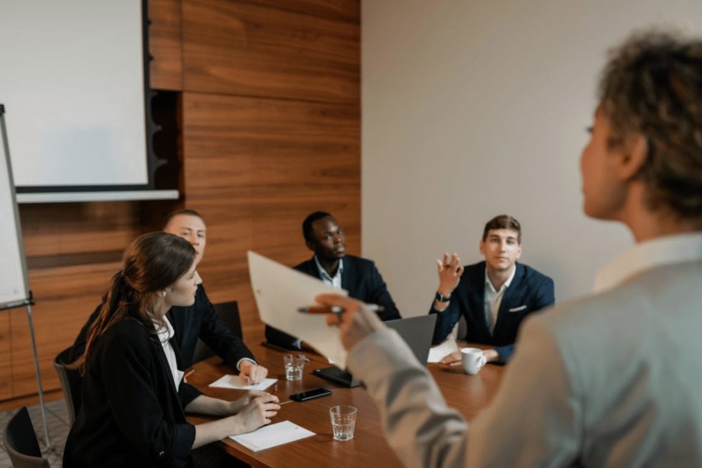 People Sitting at the Table having a Discussion