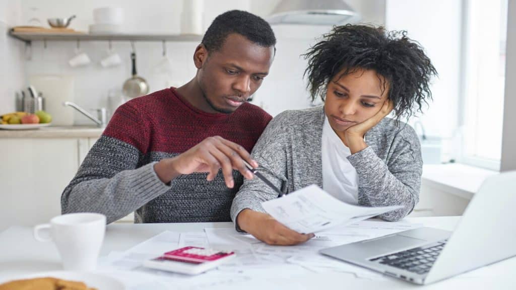 A couple looking over their bills
