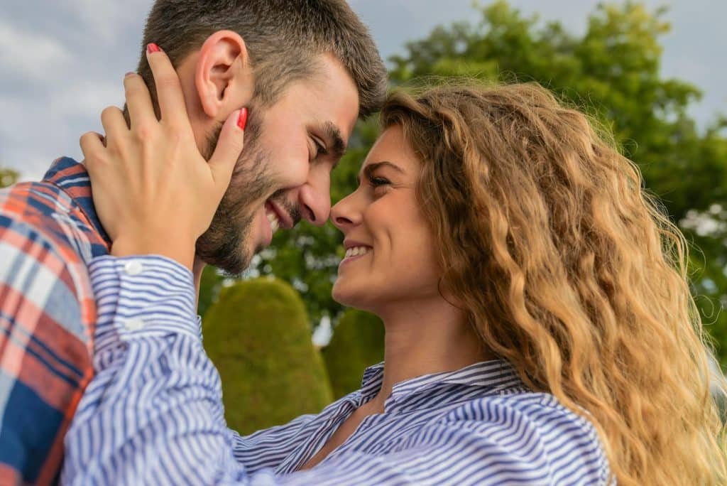 The couple lovingly looks at each other.