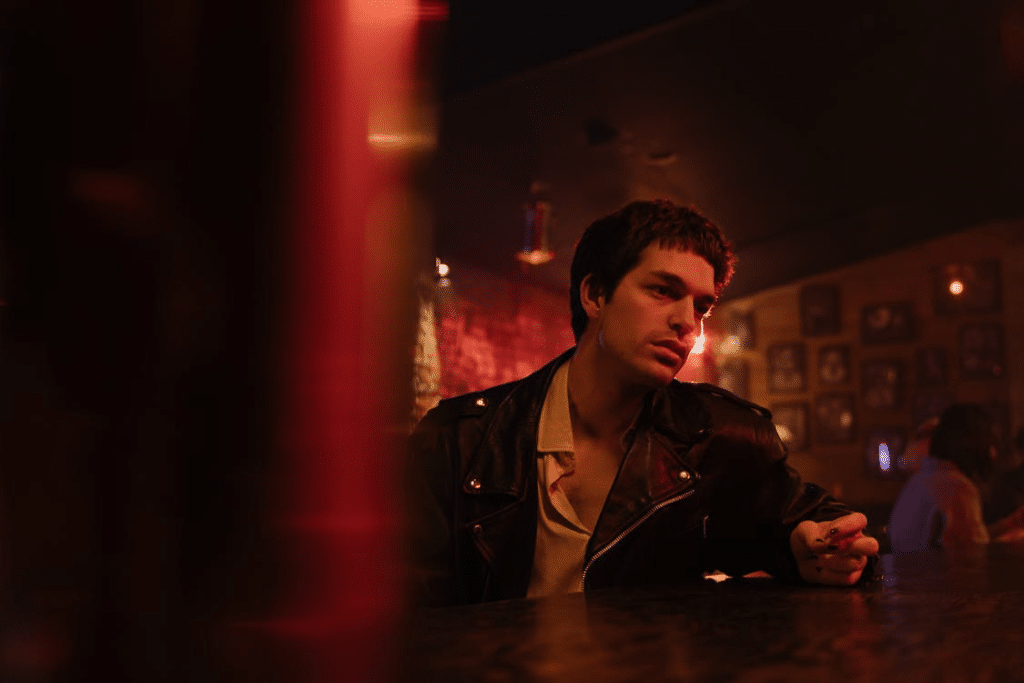 A Young Man Waiting in the Bar Counter