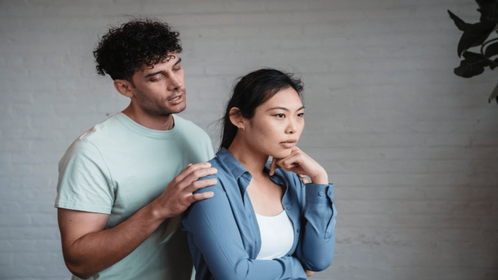 A man trying to comfort his wife