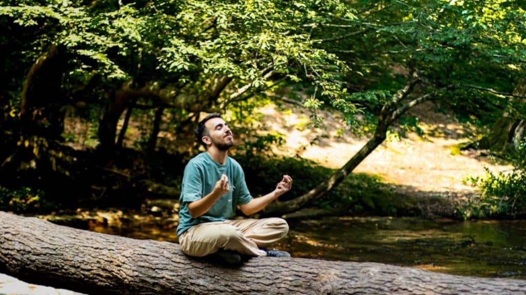 Man meditating in natural morning light