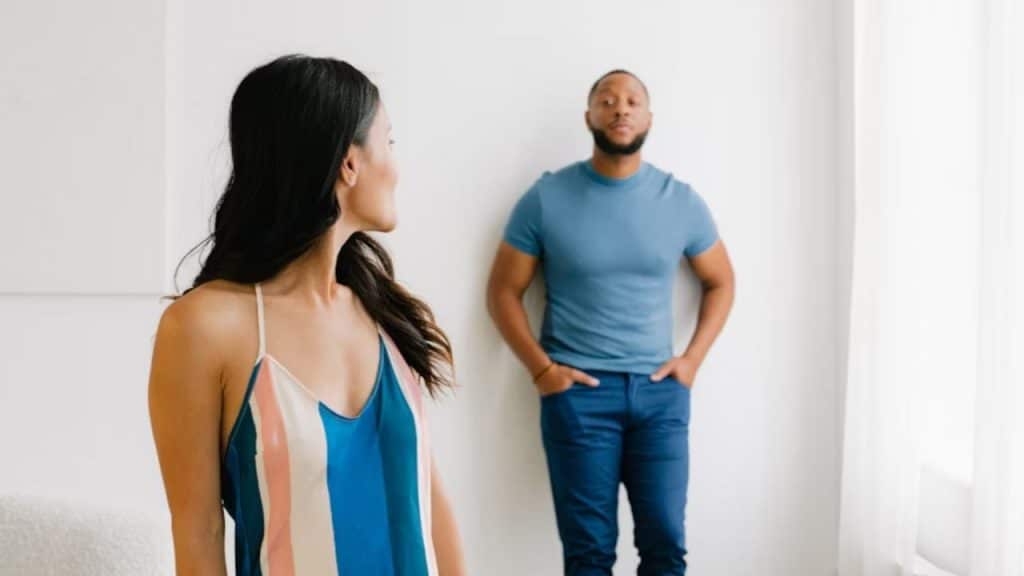 Woman emotionally tuned out as her partner speaks without connection