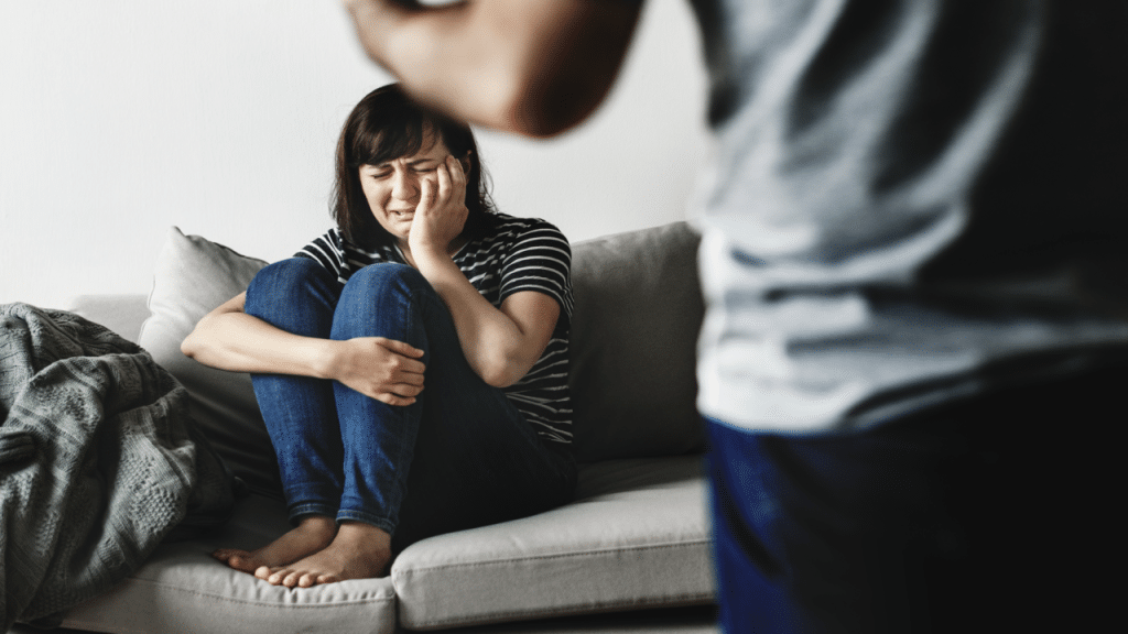 A woman crying while her husband is angry