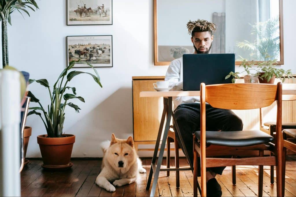 A man with a dog at home 