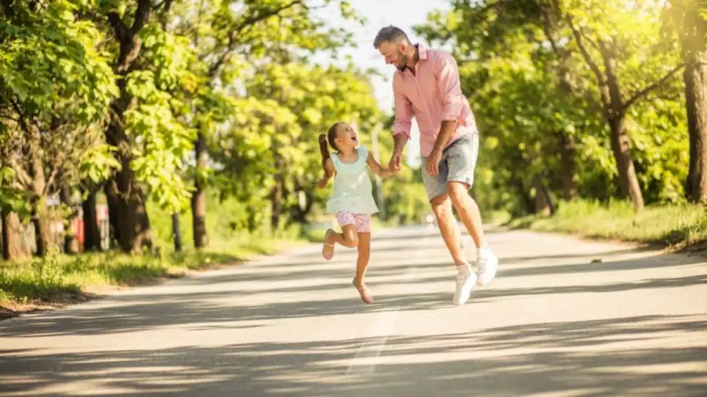 Man playing with his child in a park