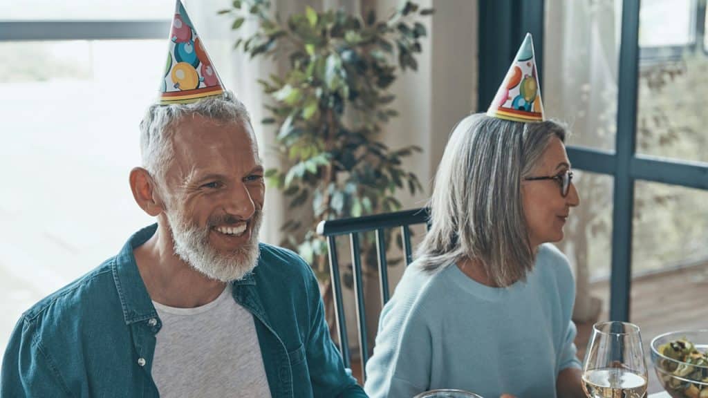 An old couple celebrating their birthday without their kids.