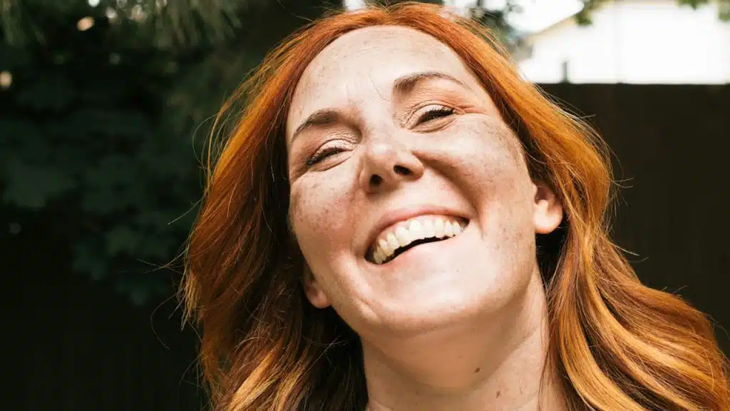 A smiling woman with a radiant expression.