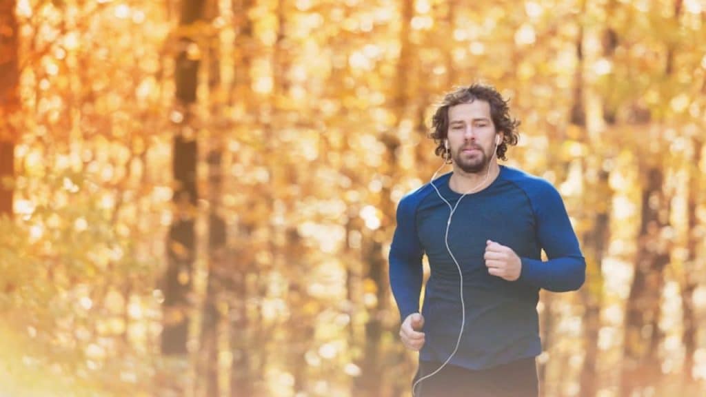 Man jogging outdoors in crisp autumn air