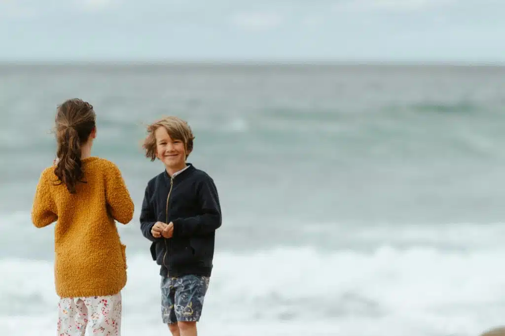 The kids are playing on the beach