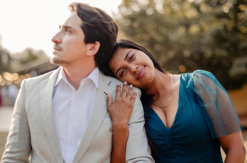 A woman holding a man