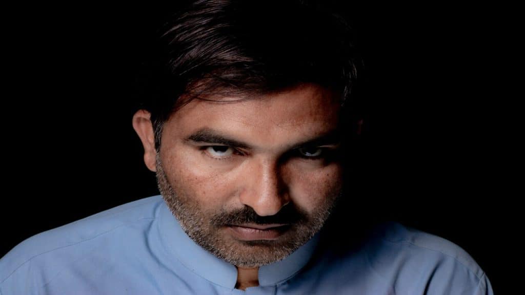 A man looking angrily towards the camera