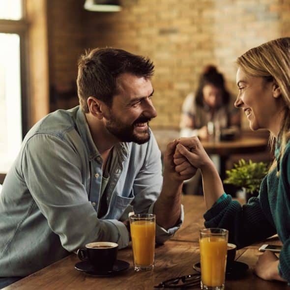 A couple on a date in a cafe.