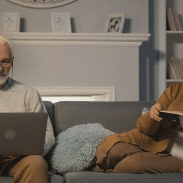 A couple ignoring each other at home