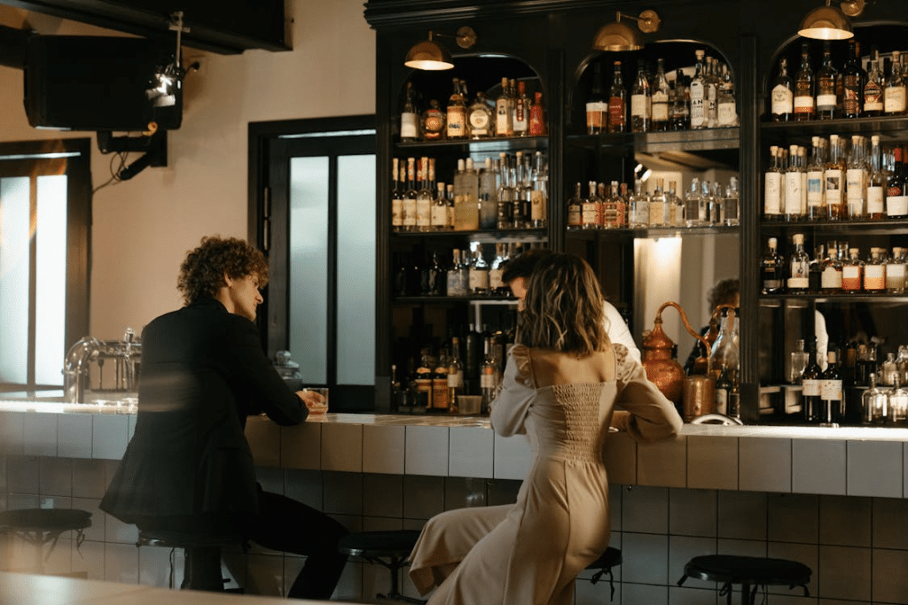 Man in Black Suit Jacket Standing Beside Woman in White Dress