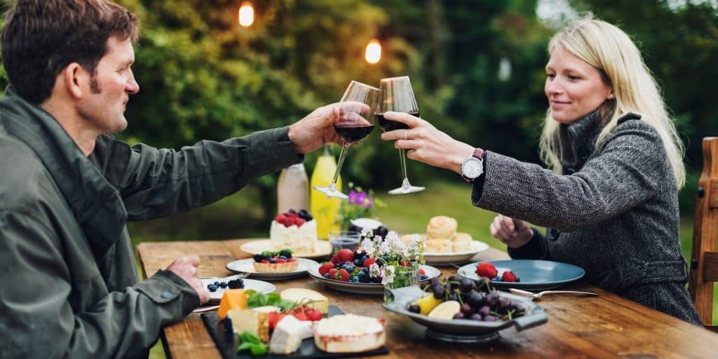 The couple are on a date, drinking wine.