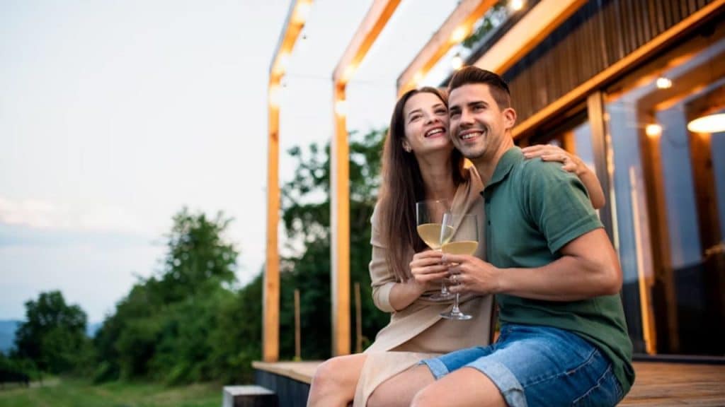 Couple smiling while enjoying a calm evening outdoors
