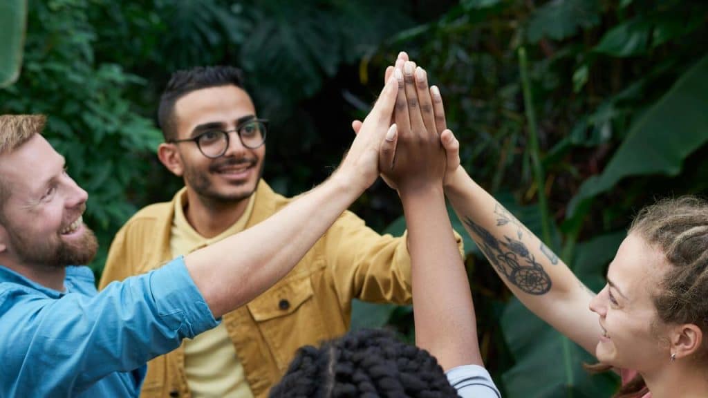 Colleagues high-fiving each other