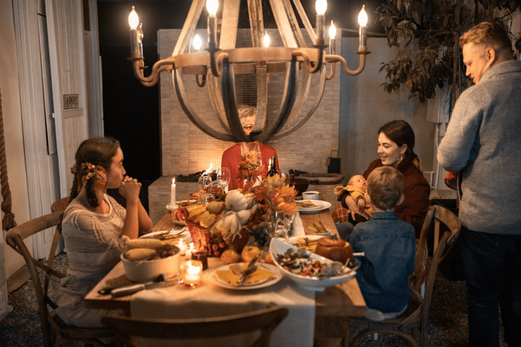 People Sitting on Chair in Front of Table With Foods