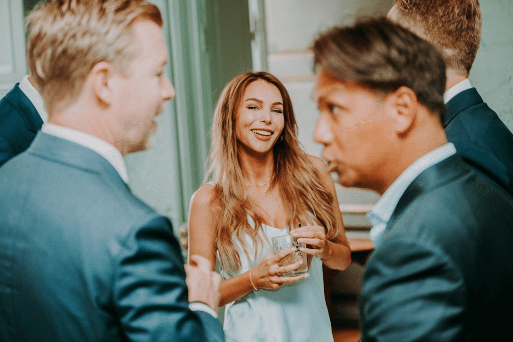 Cheerful woman and men on celebration in restaurant