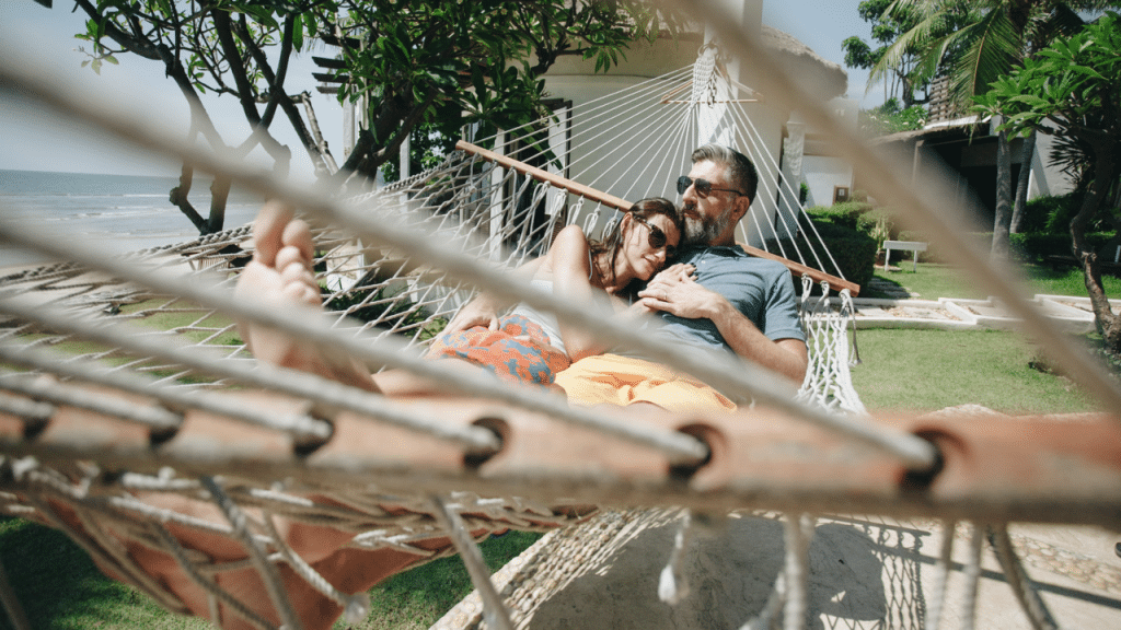 A couple relaxing on a hammock