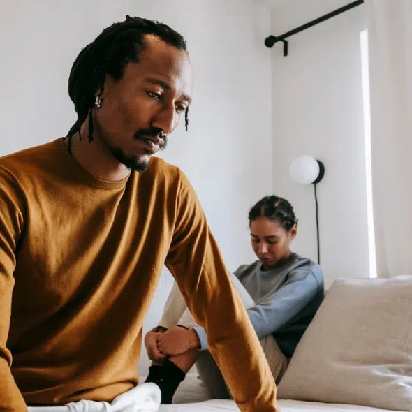 Upset black couple during dispute in bedroom