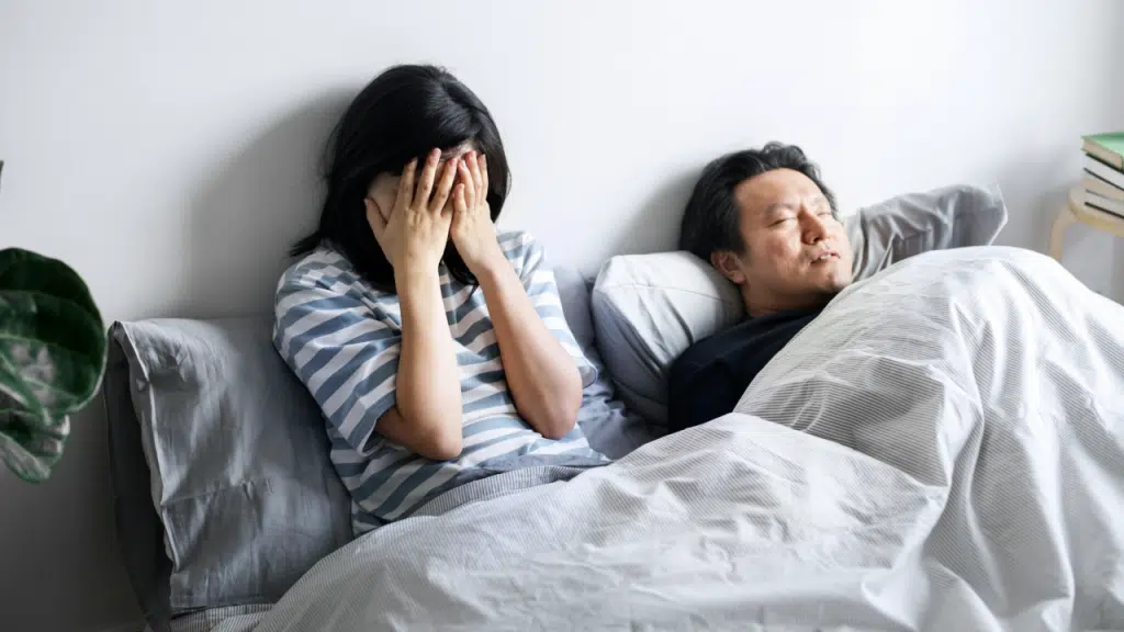 A couple looking upset at her husband