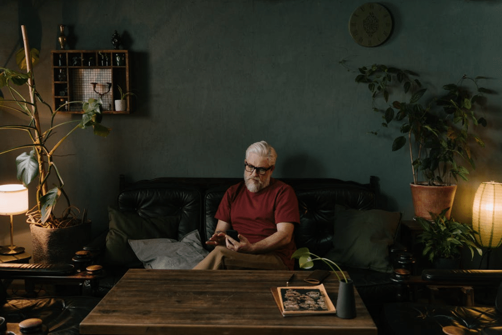 A Elderly Man Using His Mobile Phone