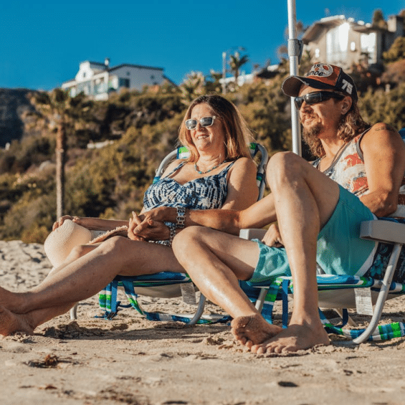 A Couple Sitting on the Shore