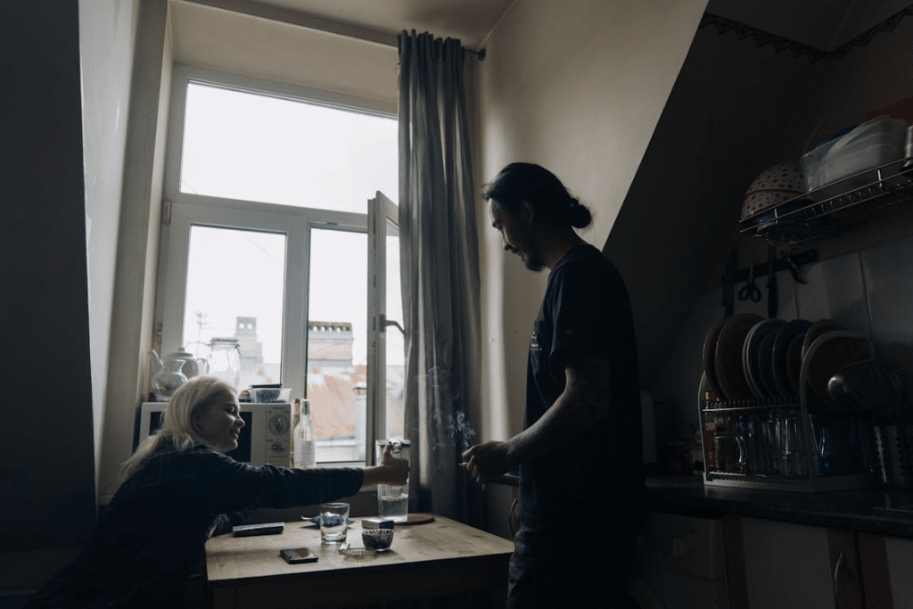A Couple Talking to Each Other While Smoking Together