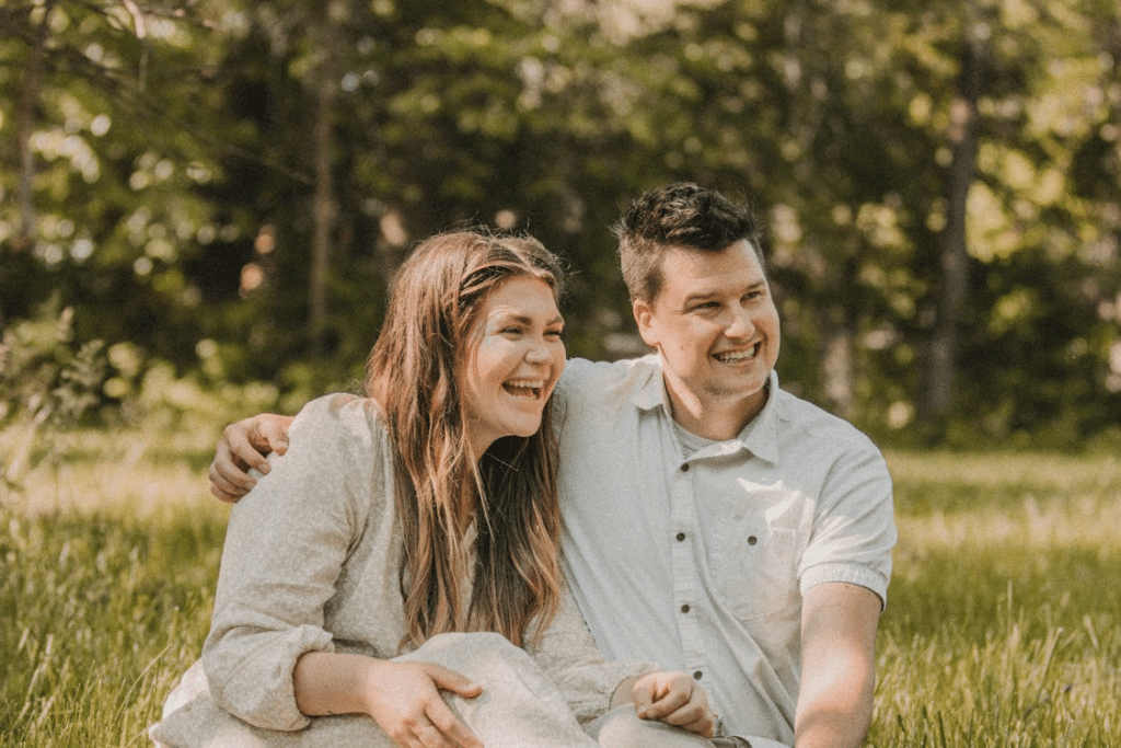 Joyful Couple in Sunlit Outdoor Setting