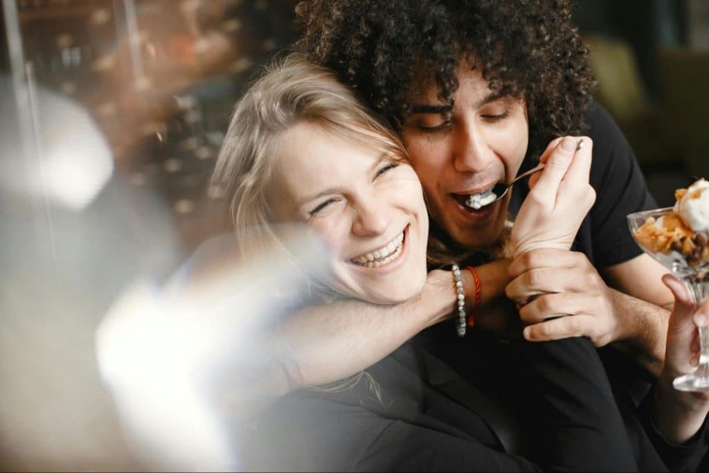 A man and woman laughing together