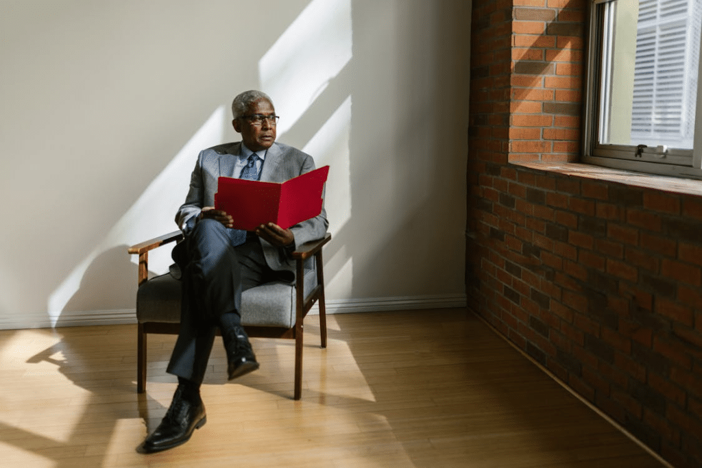 An Elderly Man Sitting on a Chair